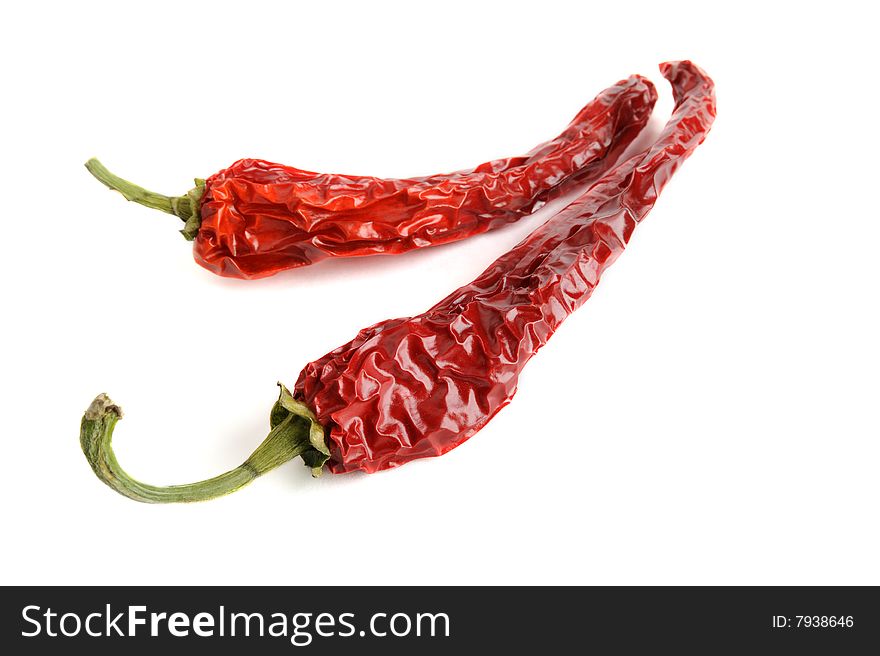 Dried red hot chili pepper isolated on white