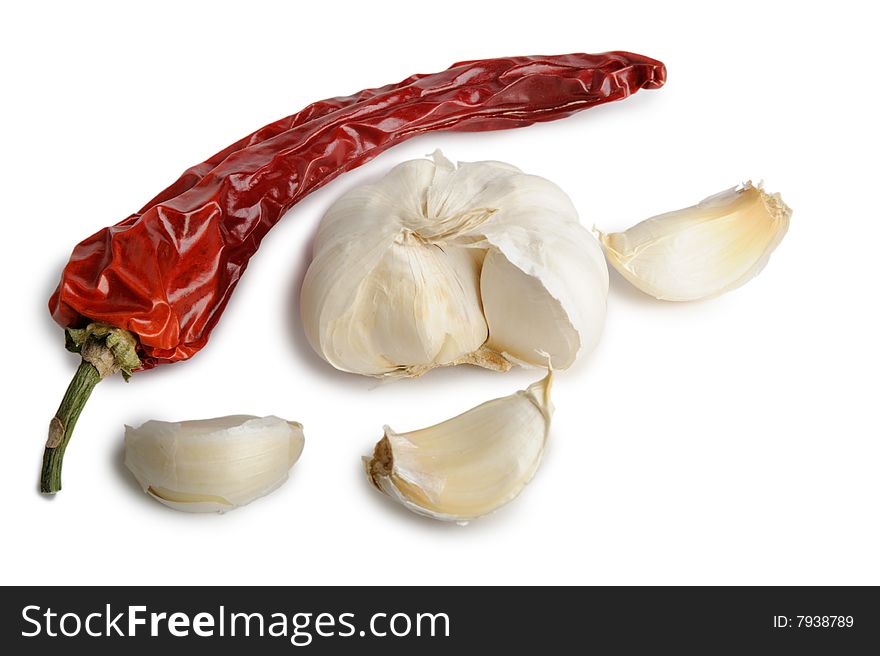 Dried red hot chili pepper with garlic isolated on white