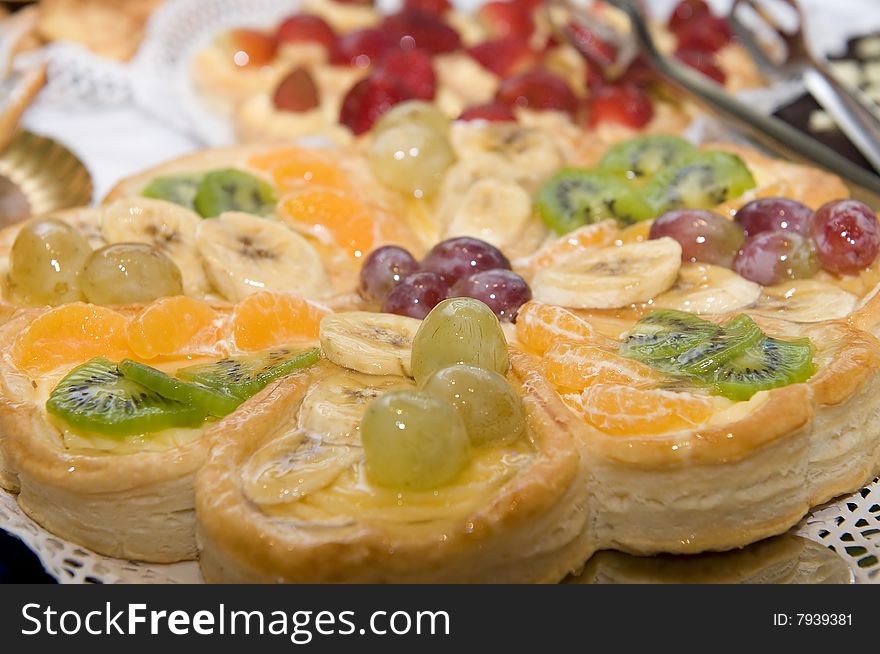 Sweet cake with grapes and cherries