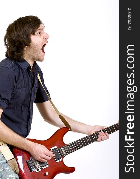 Guitar player playing his guitar and screaming. Guitar player playing his guitar and screaming