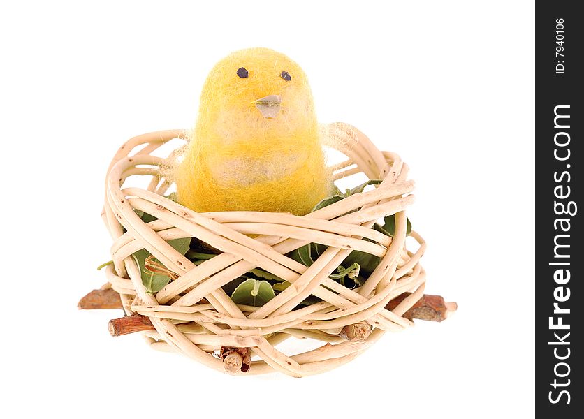 Nice woollen toy chicken in the nest.