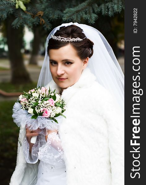 Fiancee in white clothes and bridal veil