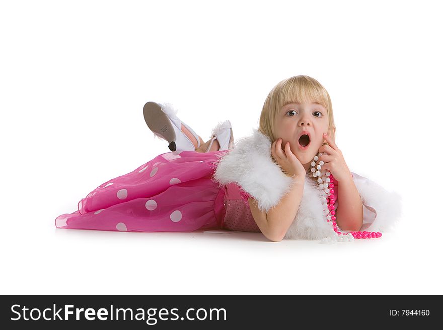 Little girl with a surprised expression, laying on the ground on white background. Little girl with a surprised expression, laying on the ground on white background.