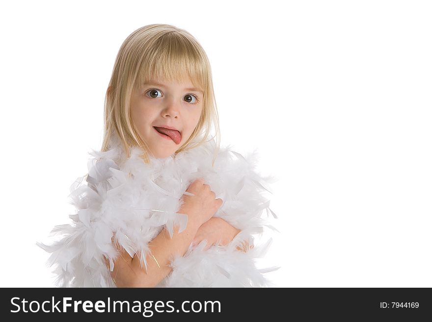 Little girl wearing a white boa making a funny face on a white background.