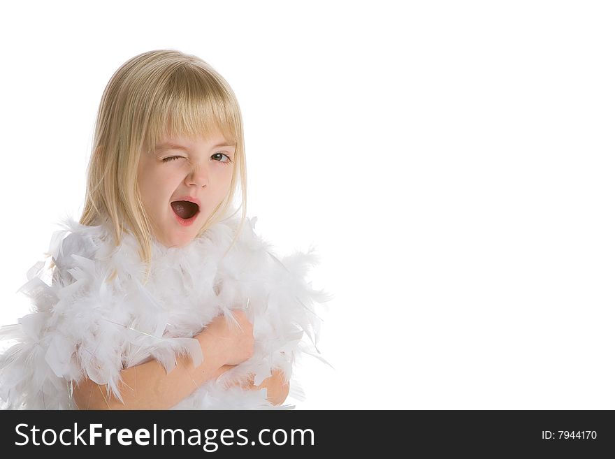 Little girl wearing a white boa winking at the camera on a white background. Little girl wearing a white boa winking at the camera on a white background.
