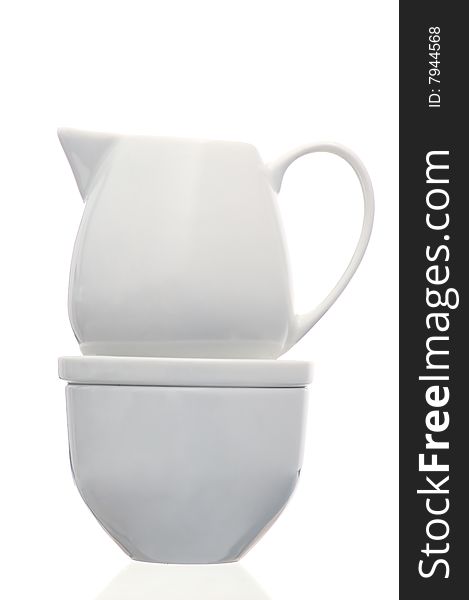 White milk jug with sugar bowl isolated on white background/. White milk jug with sugar bowl isolated on white background/