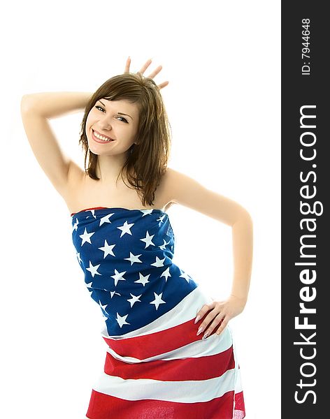 Playful girl wrapped into the American flag