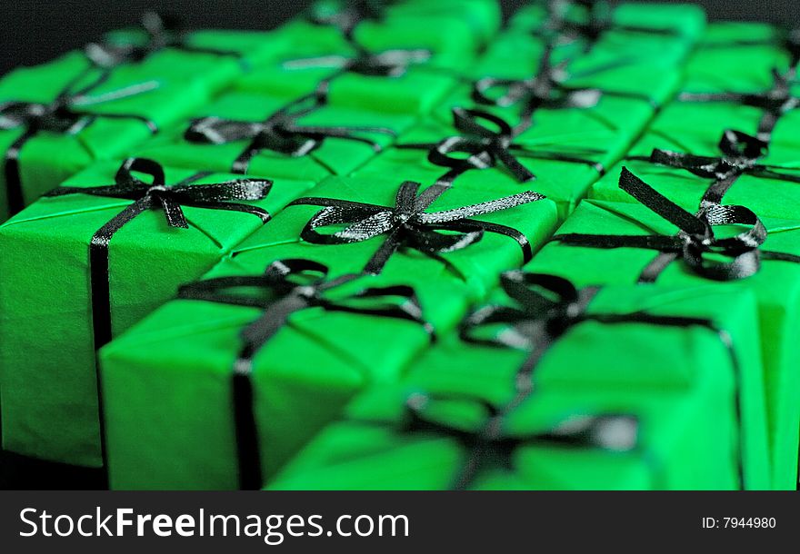 Many green gift boxes closeup