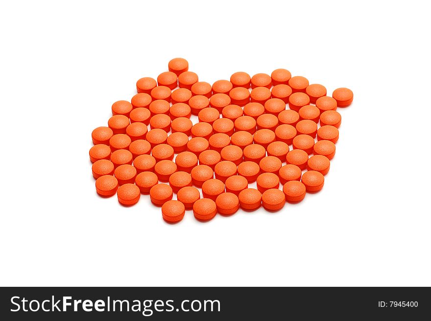Orange pills isolated on white