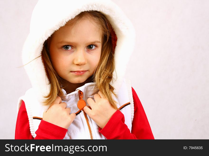 Young child's face in the hood isolated