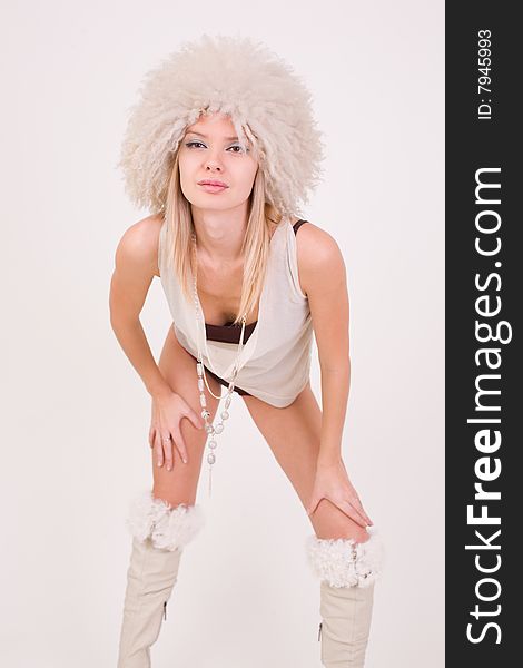 Young girl in furry hat, studio shot