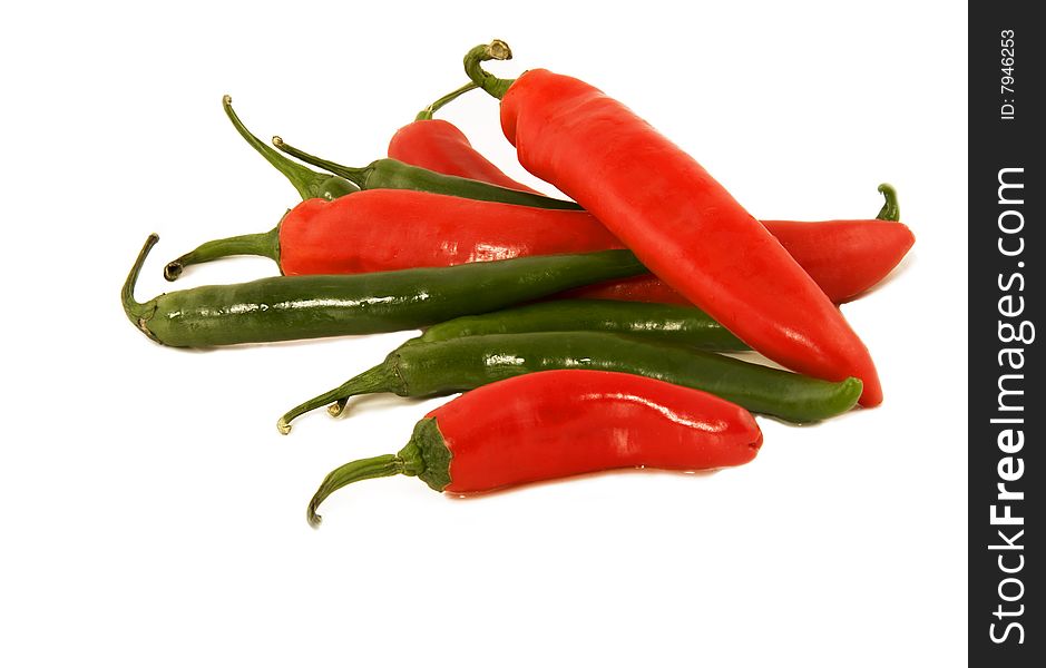 A group of red and green peppers. Isolated.