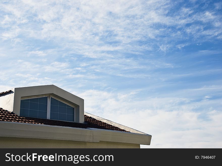 Roof of tile against the blue sky background.