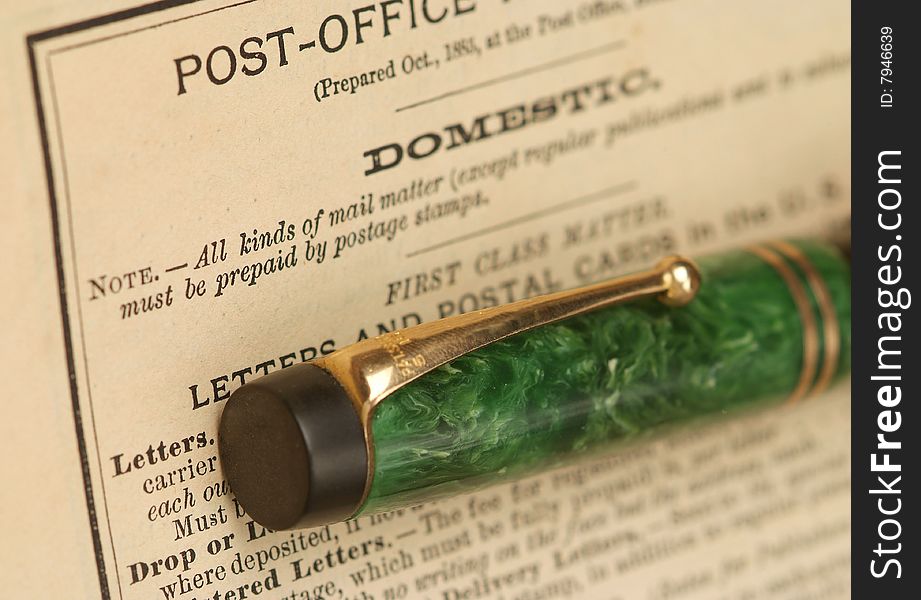 Antique fountain pen on old Post Office guidelines . Antique fountain pen on old Post Office guidelines .