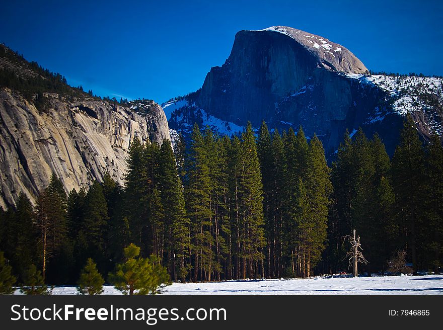 Winter scene of Half Dome and Yosemite valley floor