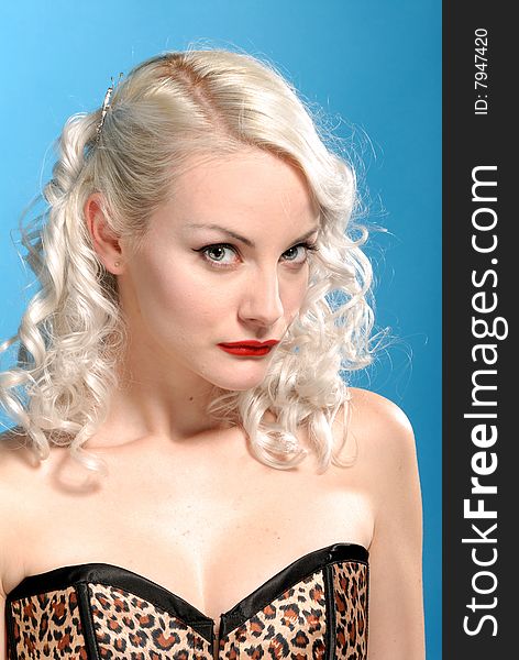 Portrait of sensual vamp blond girl in  leopard skin corset. Portrait of sensual vamp blond girl in  leopard skin corset