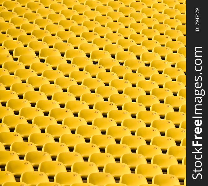 Abstract created by the repeating patterns of stadium seats