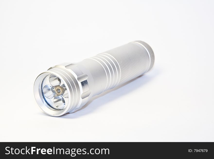 Aluminium led flashlight turned off isolated on white background. Aluminium led flashlight turned off isolated on white background