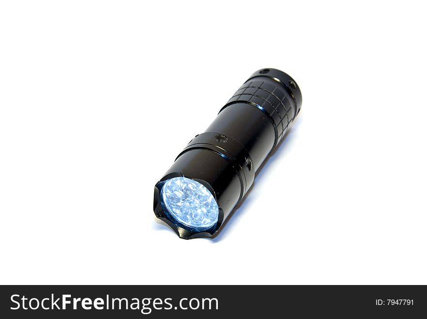 Black aluminium turned on flashlight isolated on white background. Black aluminium turned on flashlight isolated on white background