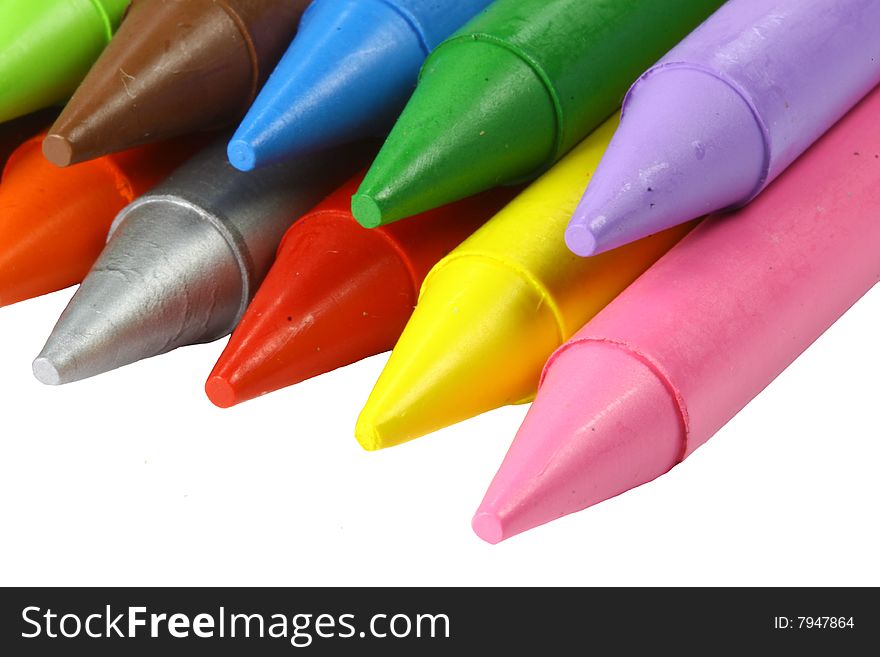 A set of colourful crayons on a white background, pink, red, blue, green, purple, silver