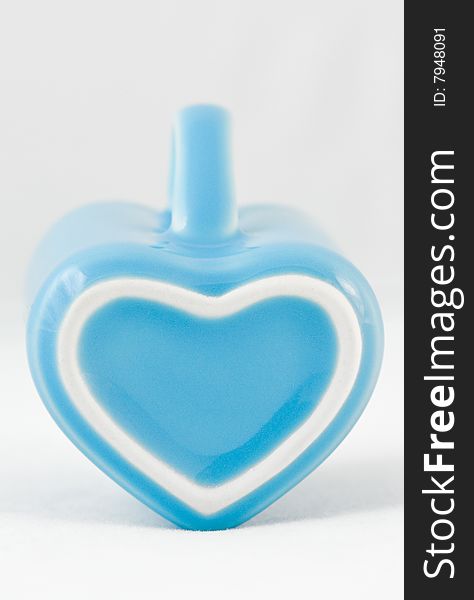 Heart-shape cup on white background