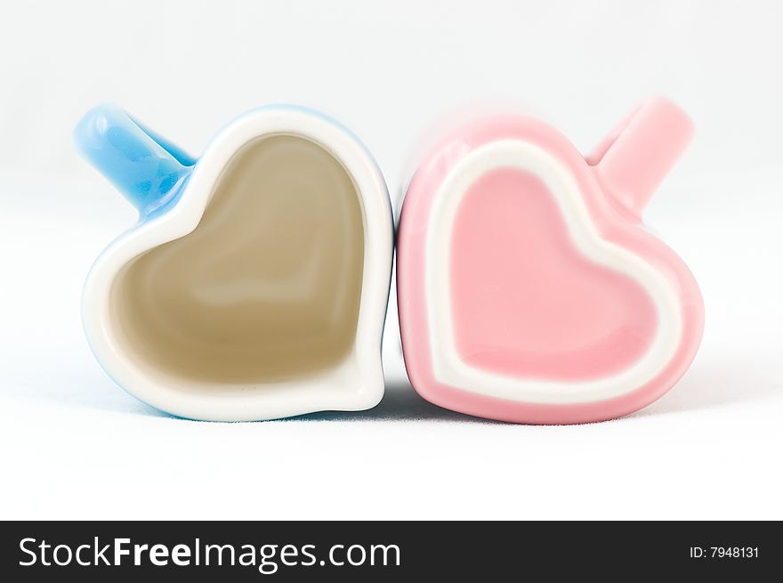 Two Heart-shape Cups On White Background