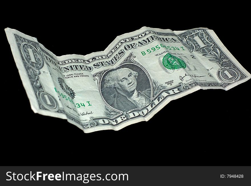 An image of an isolated wrinkled American dollar bill.  The image is to illustrate rough time in America. An image of an isolated wrinkled American dollar bill.  The image is to illustrate rough time in America.