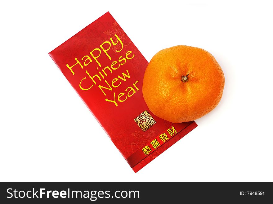 Mandarin orange and red packet isolated over white background.