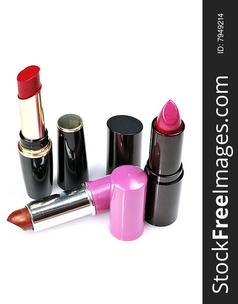 Different shades lipsticks isolated on white background.