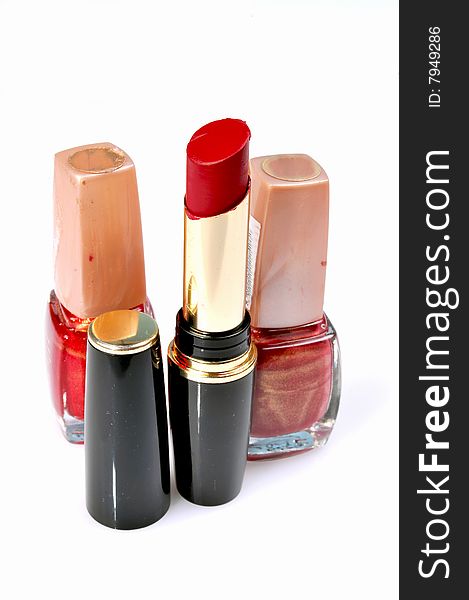 Lipsticks and nail paints isolated on white. Lipsticks and nail paints isolated on white.