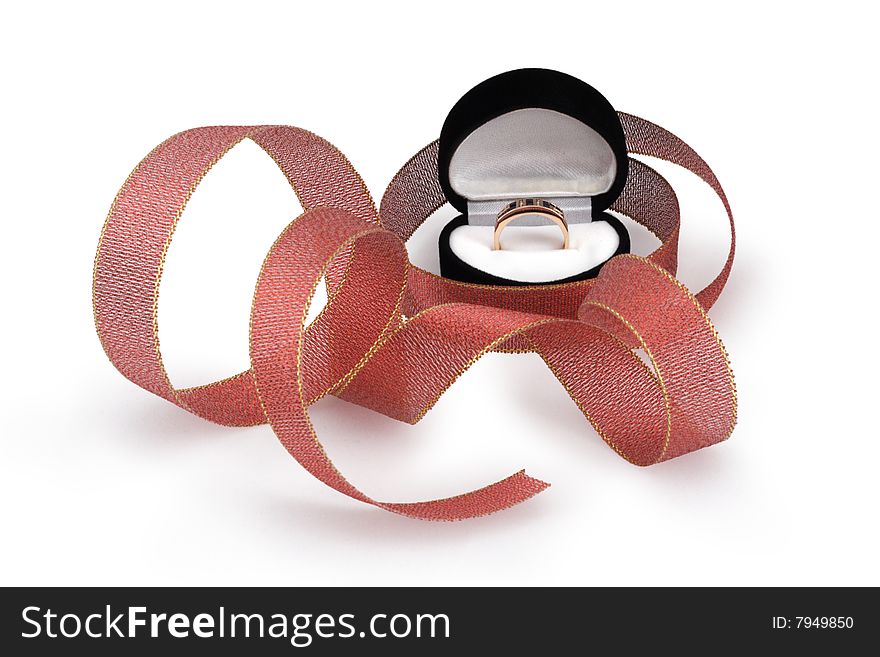 Black box with golden ring surrounded with ribbon. Black box with golden ring surrounded with ribbon.