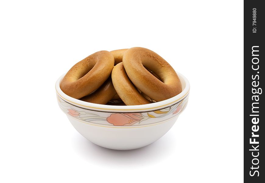 Much bagels in saucer isolated on white background with path