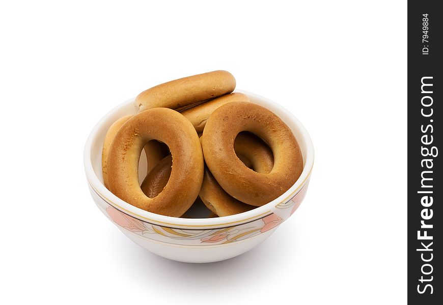 Much bagels in saucer isolated on white background with  path. Much bagels in saucer isolated on white background with  path