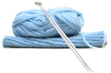 Two Knitting Needles, Woollen Yarn And Knitting. Royalty Free Stock Photo Two Knitting Needles, Woollen Yarn And Knitting. Royalty Free Stock Photo