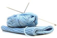 Two Knitting Needles, Woollen Yarn And Knitting. Royalty Free Stock Photography Two Knitting Needles, Woollen Yarn And Knitting. Royalty Free Stock Photography