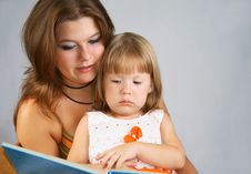 Two Sisters Read The Book Stock Photos