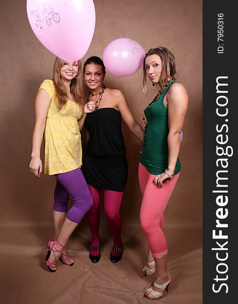 Three girls with balloons in studio. Three girls with balloons in studio