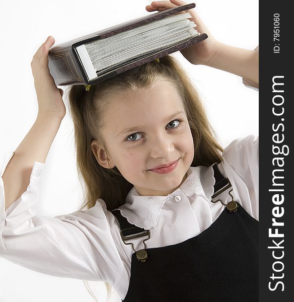 Young student in the classroom with a book. Young student in the classroom with a book