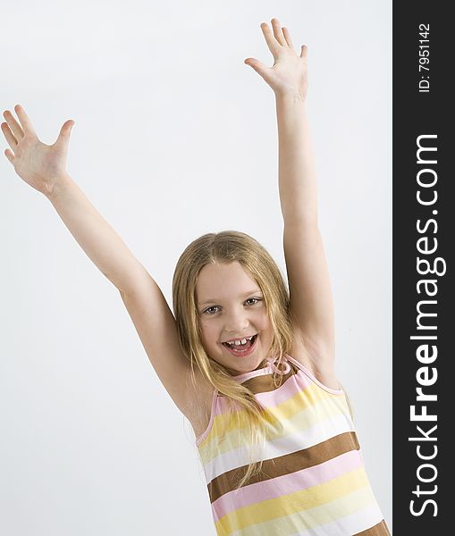 Happy little girl on a white background