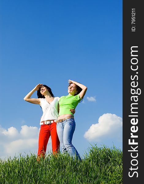 Two happy young women dreams to fly on winds