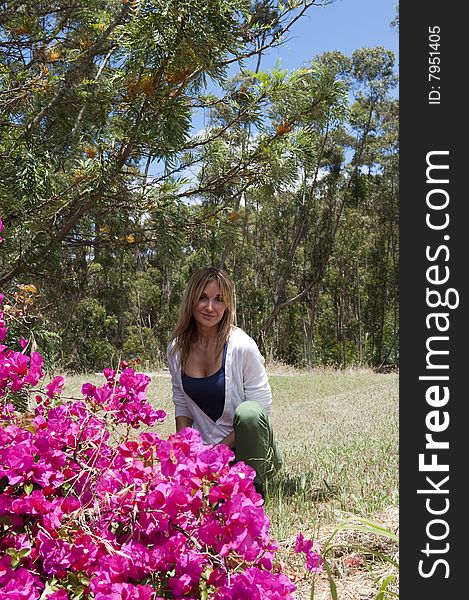 Woman and bugonvia flowers