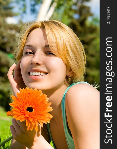 Woman Rest In The Park With Flower