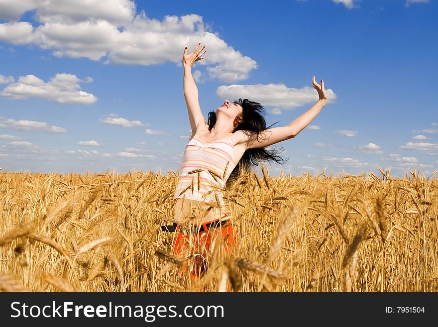 Woman in golden wheat