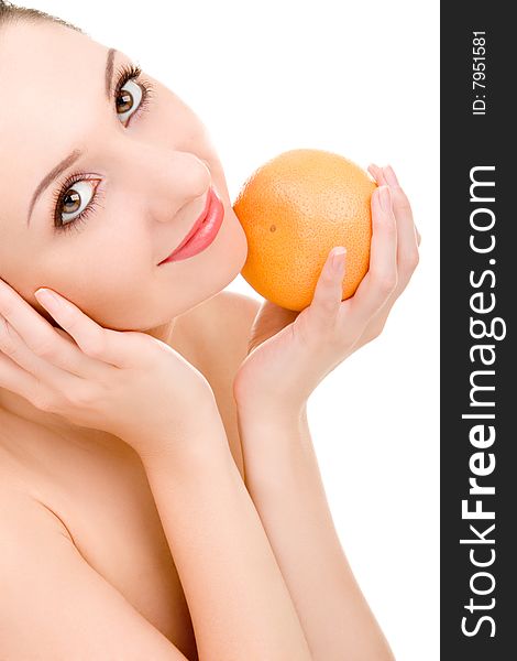 Pretty woman with orange isolated on the white background