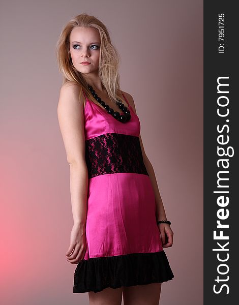 Beautiful blond fashion model posing in studio. Beautiful blond fashion model posing in studio