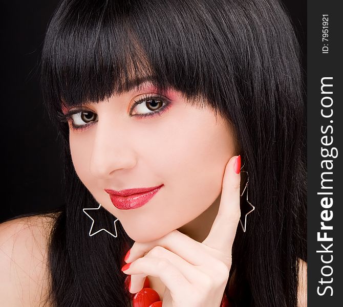 Portrait of the charming woman on black background