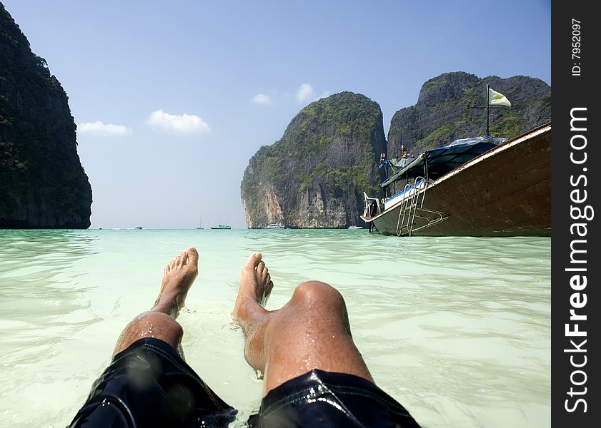 Man floats in tropical water. Man floats in tropical water