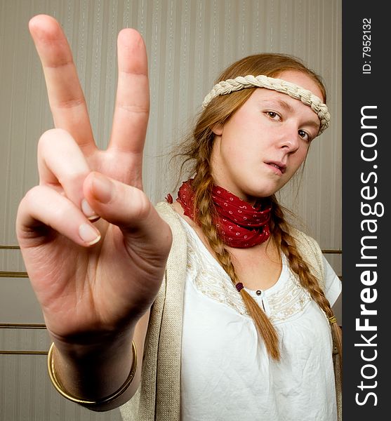 Alternative hippy girl halds hands in the peace sign. Alternative hippy girl halds hands in the peace sign