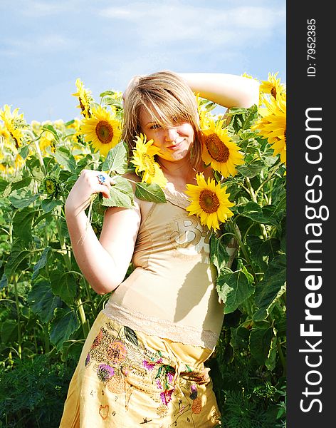 The girl on a floor with sunflowers. The girl on a floor with sunflowers