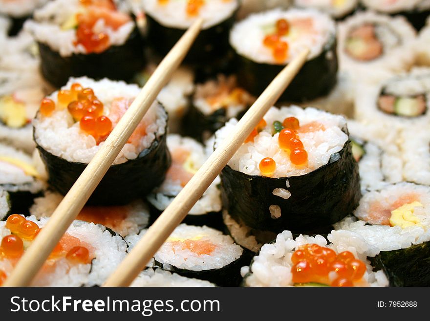 Sushi plate with chopsticks. Shallow dof.